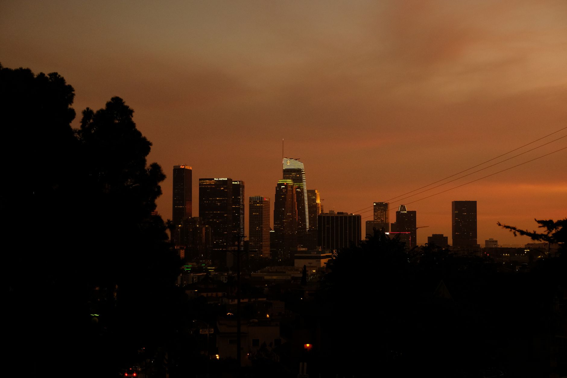 Los Angeles skyline at dusk with the Hollywood hills behind